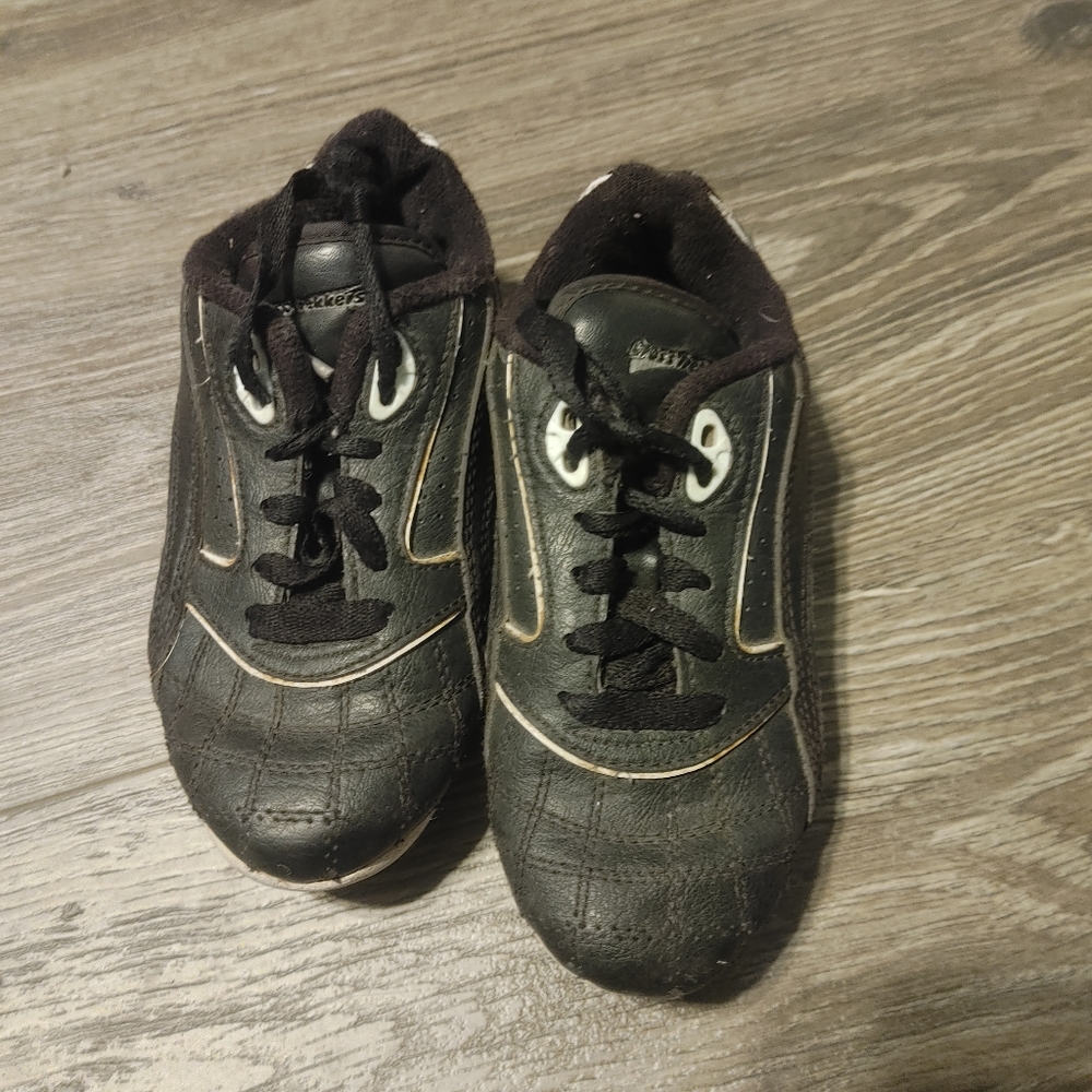 Kids black sports cleats